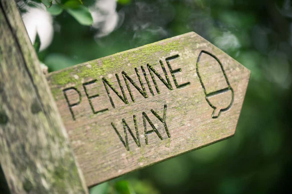A carved wooden Pennine Way fingerpost — the Dales on the doorstep